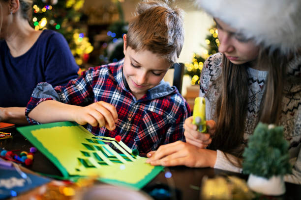 istock Family making Christmas cards 1181849765