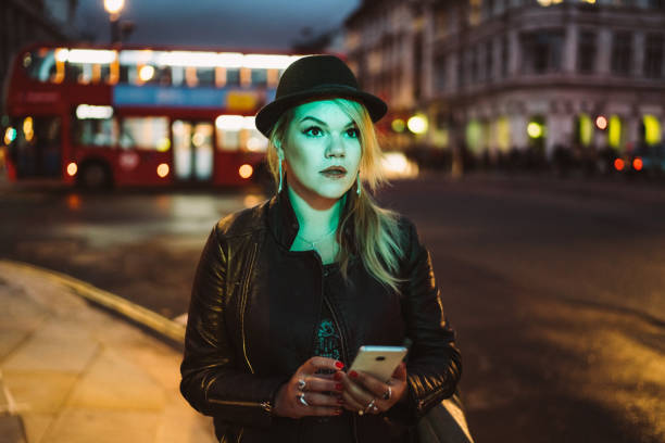 istock Tourist woman lost in London using smartphone for navigation 1181855344