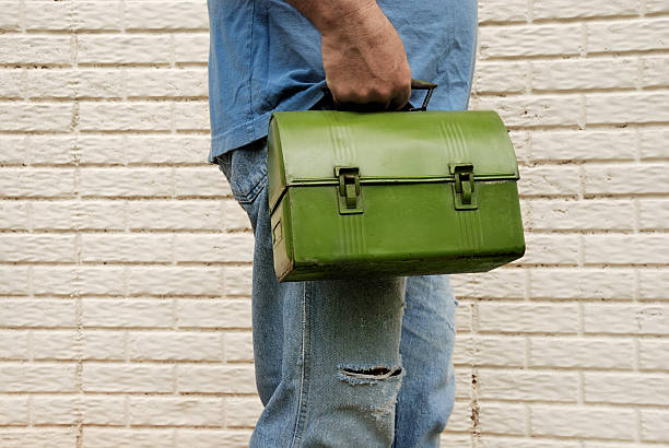 istock Man carrying lunch box to work. Manual laborer. 118185540