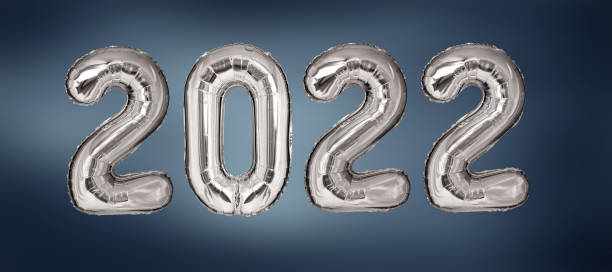 istock New Year 2022 silver balloons on blue background 1181855530
