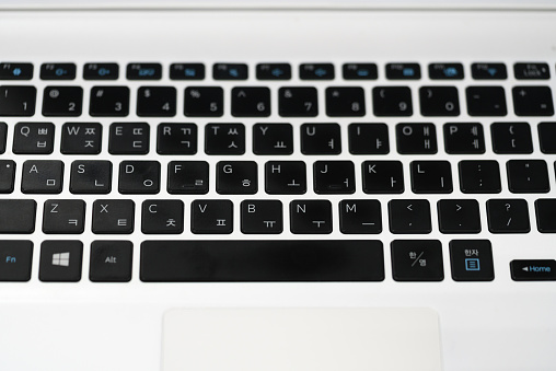 Close-up view of Korean and English keyboard Windows laptop keyboard black color alphabet button, by Samsung Electronics Co., Ltd. is South Korean electronics company. Kamchatka, Russia - Oct 17, 2019