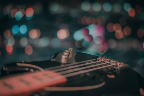 istock Electric bass guitar blurred background 1181860352