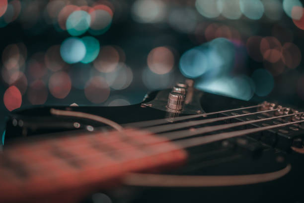 istock Electric bass guitar blurred background 1181860354