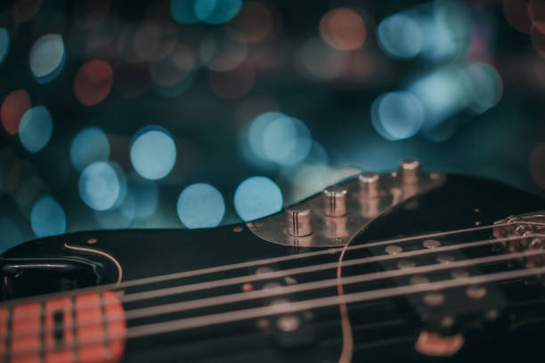 istock Electric bass guitar blurred background 1181860355