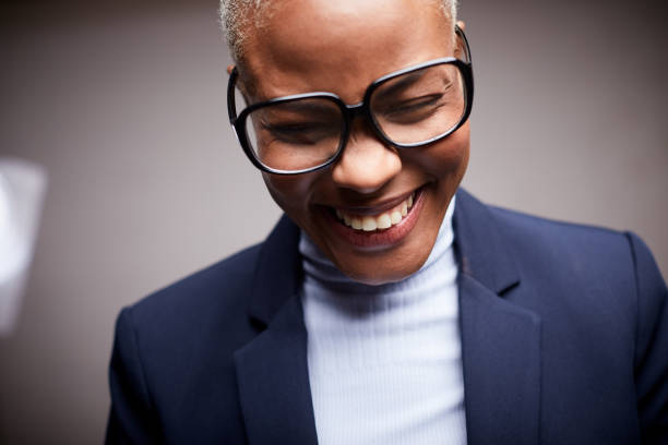 Afro Caribbean woman, dressed in a suit and wearing glasses, smiling and shy. Lifestyle coffee shop made in Barcelona.
Afro Caribbean woman, dressed in a suit and wearing glasses, smiling and shy. horn rimmed glasses stock pictures, royalty-free photos & images