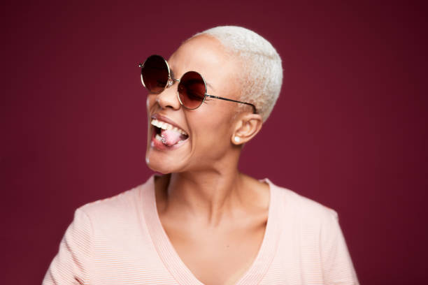 istock A woman making faces and sticking out tongue. 1181860687