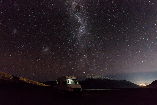 Camper van just outside Queenstown at Crown Range lookout in New Zealand.