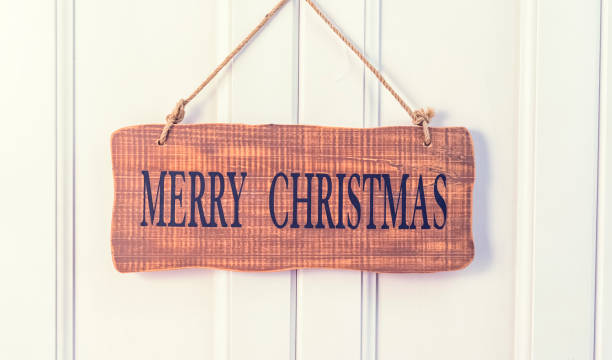 istock Merry Christmas written on wooden background 1181865709