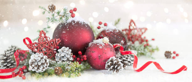 istock Christmas Baubles on a White Wood Background 1181867105
