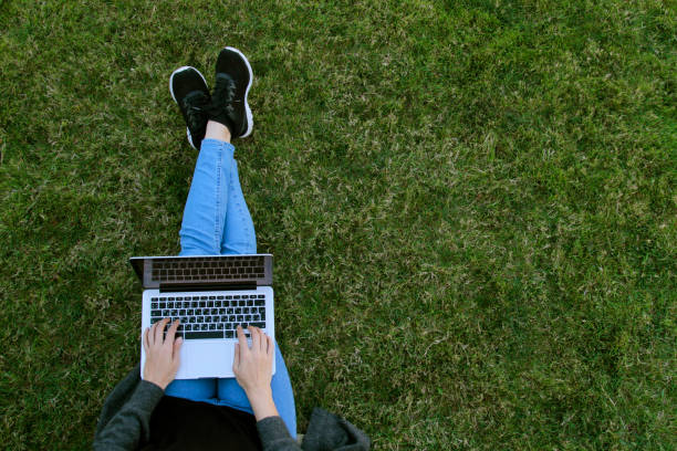 istock Close-up woman texting using her laptop 1181868981