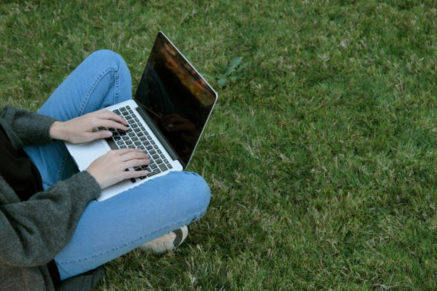 istock Close-up woman texting using her laptop 1181869143