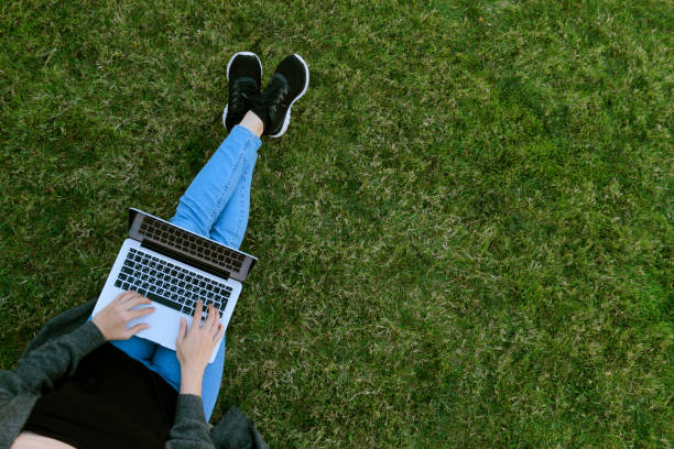 istock Close-up woman texting using her laptop 1181870163
