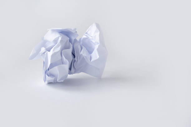 istock A clump of crumpled white paper on a white background. 1181870568