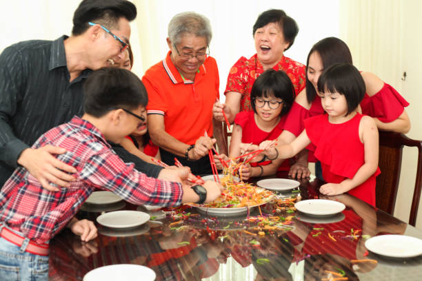 istock Chinese New Year Celebration Tossing Yeesang 1181870699