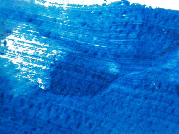 istock Blue and white acrylic painting texture on white paper background by using rorschach inkblot method. 1181872498