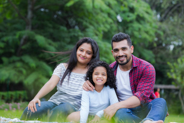 Happy family have fun in the park stock photo Bangalore, India, Family, Picnic, Outdoors happy indian young family couple stock pictures, royalty-free photos & images
