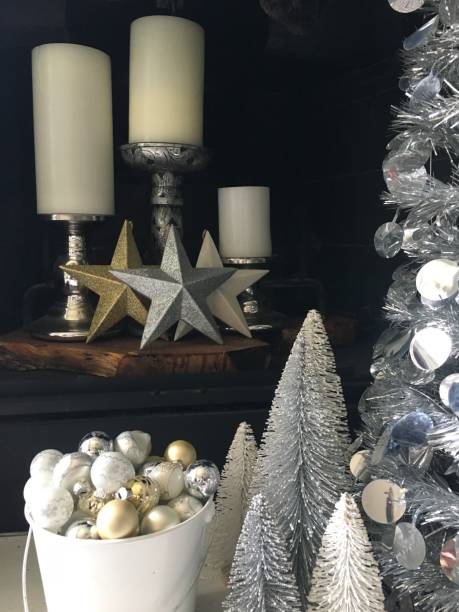 istock Silver gold and white Christmas decorations in front  of fireplace 1181873862
