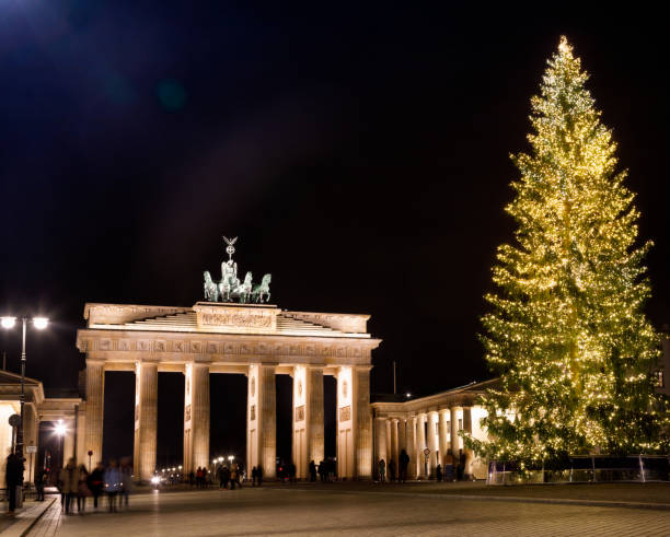 istock Brandenburg Gate and Christmas Tree at night Pariser Platz Mitte Berlin Germany 1181875725