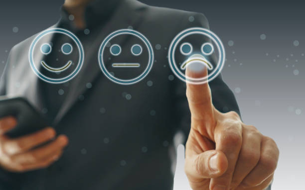 istock Businessman giving rating with sad icon 1181875727