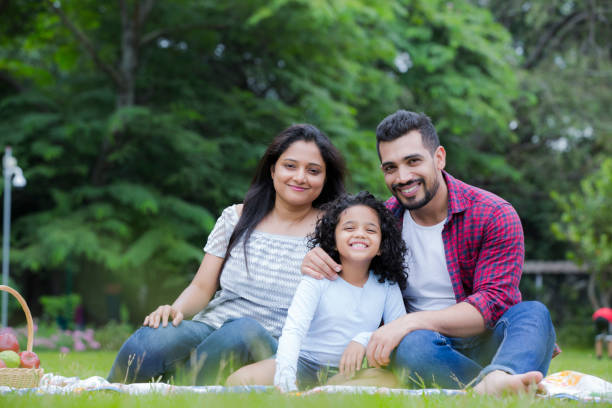Happy family have fun in the park stock photo Bangalore, India, Family, Picnic, Outdoors happy indian young family couple stock pictures, royalty-free photos & images
