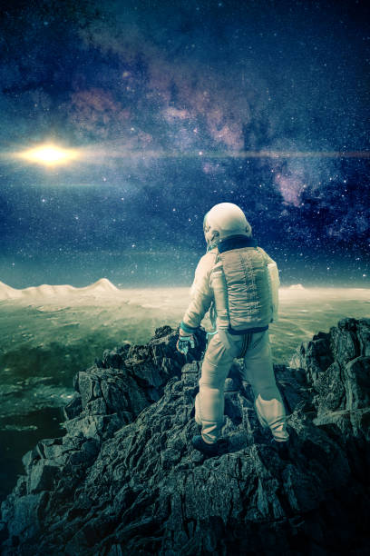 istock Astronaut climbs mountain on the moon -3D-Illustration, , 1181877194