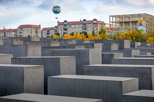 Berlin, Germany, September 24, 2019: View of Memorial to the murdered Jews of Europe in Berlin. It is also known as Holocaust Memorial. On one hand a popular tourist destination and on the other hand a memoral for on of the darkest periods of European history. The monument is designed by the architect Peter Eisenman and the engineer Buro Happold.
