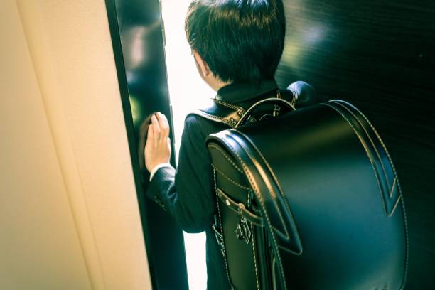 boy and Randoseru Japanese boy and new school bag which is randoseru randoseru stock pictures, royalty-free photos & images