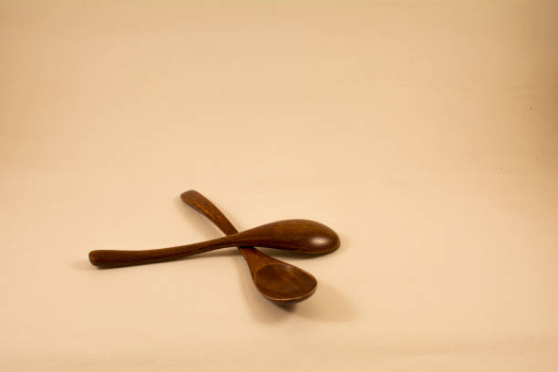 istock Two wooden teaspoons lie on the table 1181878514