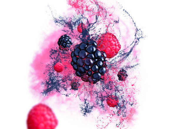 Raspberries and blackberries falling from the air on white background with fruit juice. stock photo