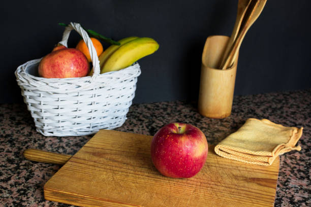 istock Fruit still life with a white basket and black background 1181885754