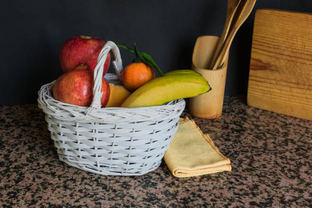 istock Fruit still life with a white basket and black background 1181885771