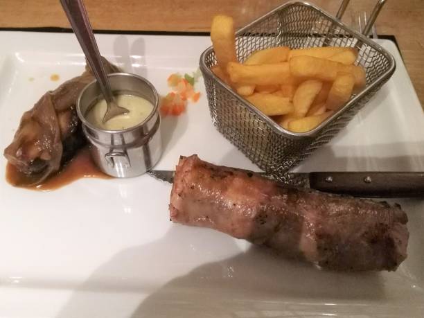 istock Grilled andouilette with fries 1181889331