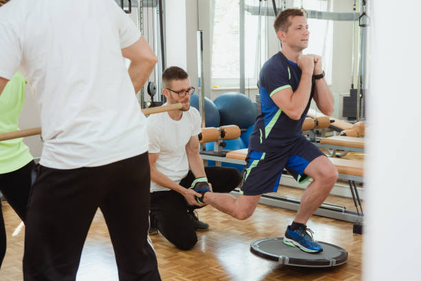 istock Man exercising on a balance board 1181889857
