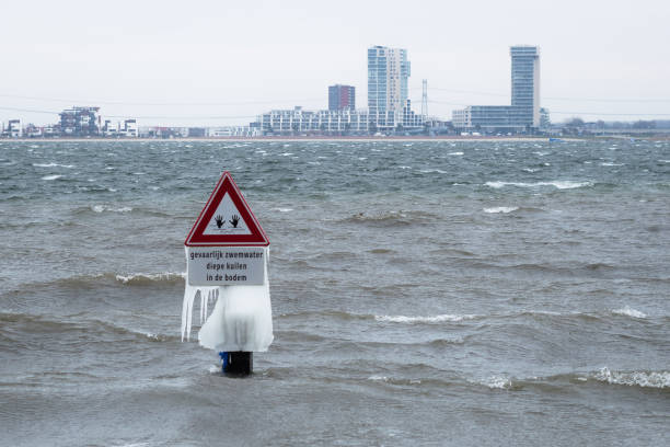 istock Icicles hanging on a warning sign in a lake 1181890460