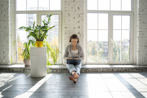 istock Focused young lady working in her laptop 1181891799
