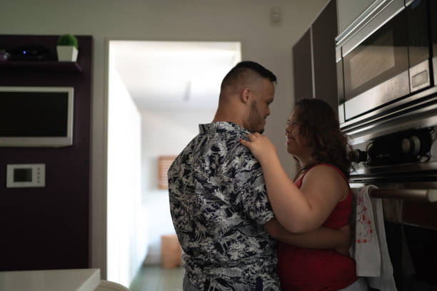 istock Special needs couple dancing in the kitchen 1181891829