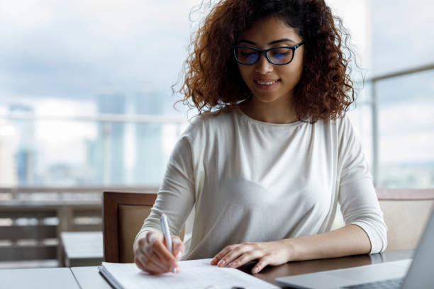 istock Young woman working at a cafe 1181892981