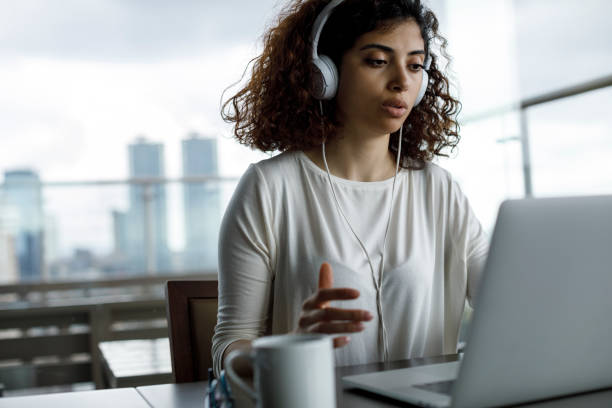 istock Young woman working on laptop 1181892982