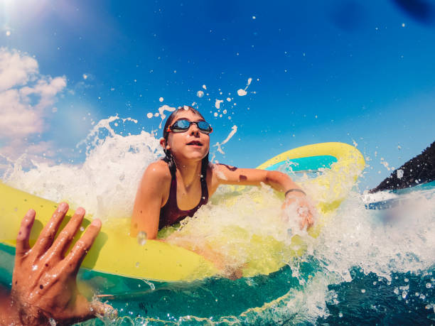 istock Girl having fun on the beach 1181893534