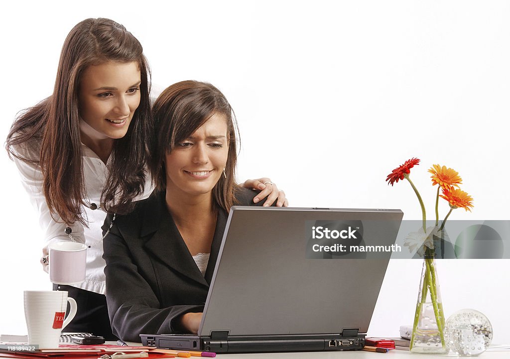 got funny pic in e-mail Two office worker women look at an e-mail with funny pic in coffee break. Administrator Stock Photo