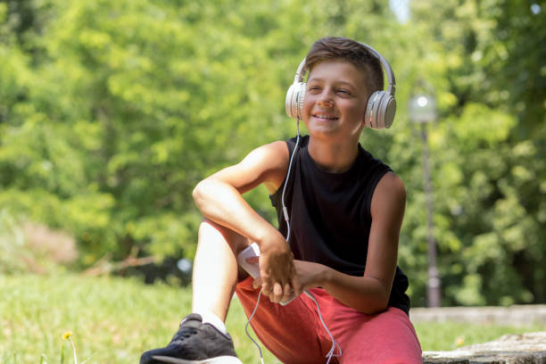 istock Joyful boy with headphones 1181894314