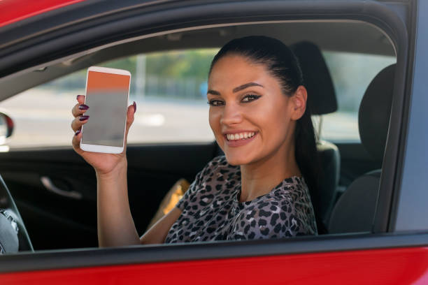 istock Woman holding phone and smiling 1181894336