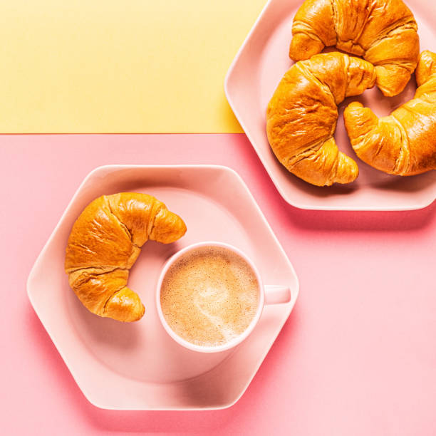 istock Coffee and croissants on a bright trendy background 1181894977