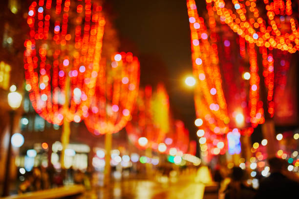Beautiful Christmas illumination on Champs Elysees in Paris, France, abstract blurred view