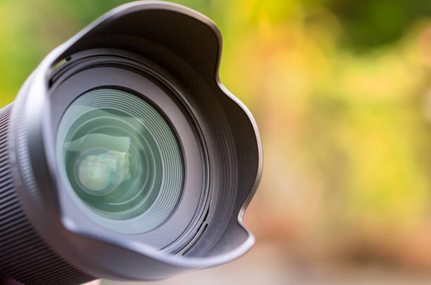 istock Camera Lens with reflection in the beautiful Colourful Nature Background 1181897096