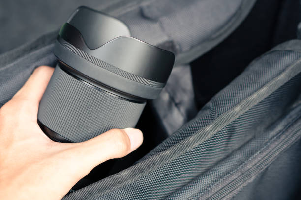 Photographer keep Camera lens in the bag, packing for travel and work
