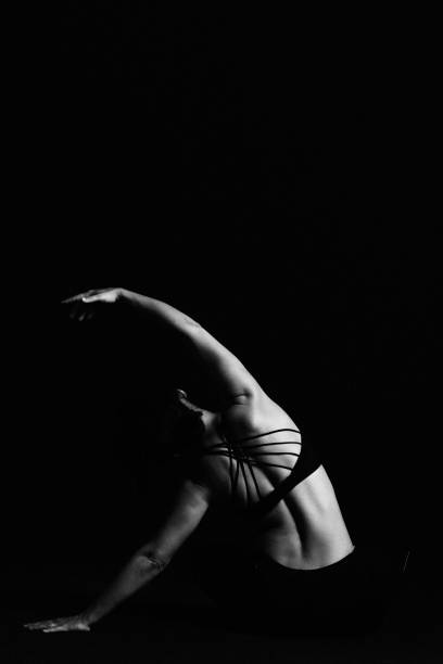 istock Yoga poses at black background monochrome 1181897411
