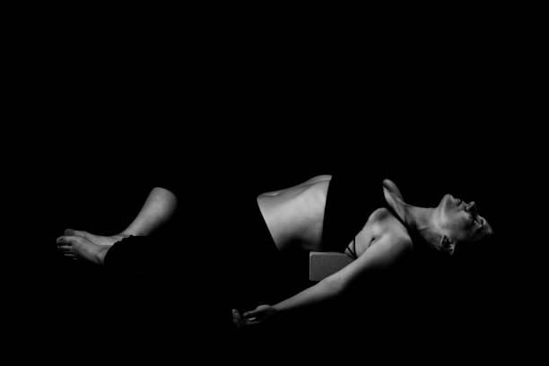 istock Yoga poses at black background monochrome 1181897422