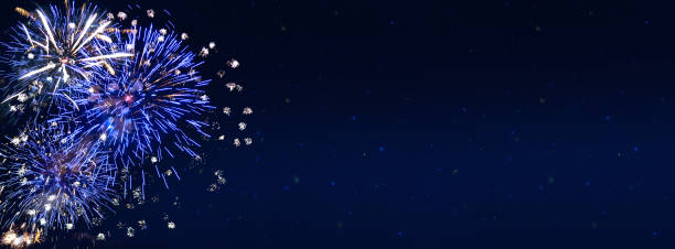 Fireworks, colorful sylvester-fireworks banner on black background with sparks stock photo