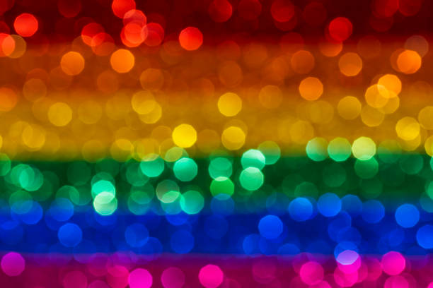 istock Rainbow flag with bokeh light effect, LGBT movement concept 1181899035